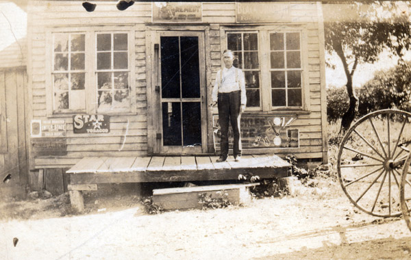 Ollie Burton in Front of Burtonville Store